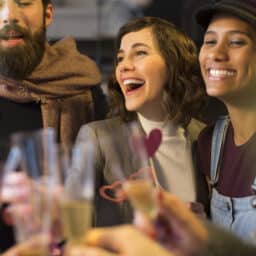 Happy group of friends toasting in the new year.