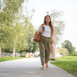 Relaxed woman taking a walk on a peaceful sunny day
